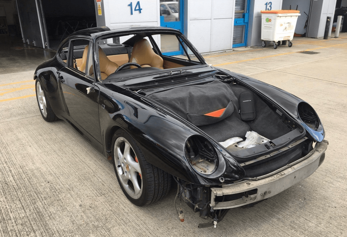 Black classic sports car during the refinishing process