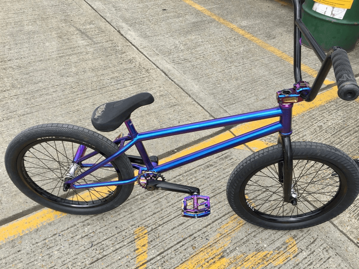 Iridescent blue and purple BMX bicycle after refinishing