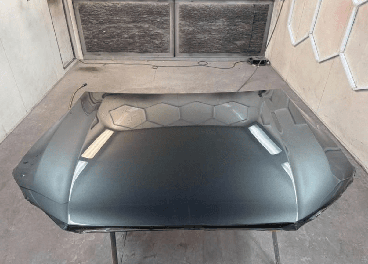 Dark grey painted bonnet in the spray booth